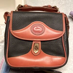 Dooney and Bourke cross body bag. Vintage. In excellent shape.